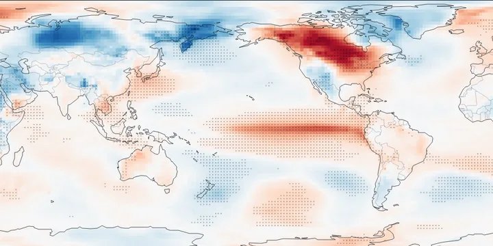 Global map of December temperature in El Ni&ntilde;o years minus climatology: warm along the equatorial eastern Pacific and over Alaska and western Canada, dotted where significant